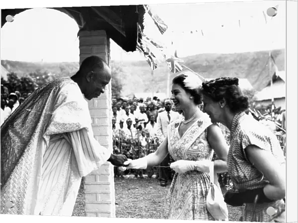 Queen Elizabeth II meets a miner at his home during her tour of the UDI siding housing