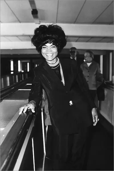 American actress and singer Eartha Kitt arriving at Heathrow Airport in London to have