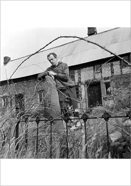 Author Alan Garner in his back garden at Toad Hall, Blackden-cum-Goostrey, Cheshire