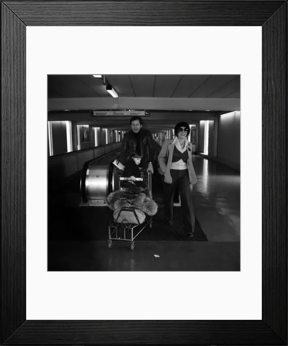 Framed Print : Joan Collins and Family Leaving Heathrow Airport Print 1975 Framed Print : Joan Collins and Family Leaving Heathrow Airport Print 1975