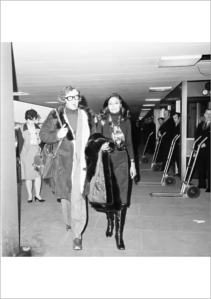 Actor Michael Caine and wife Shakira seen here at Heathrow Airport. April 1975 75-1940