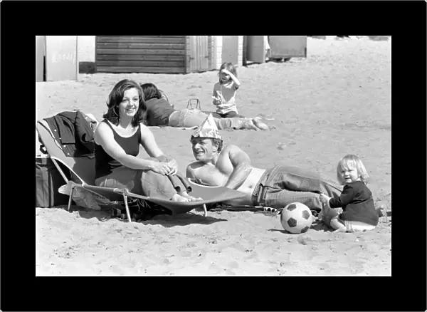 A family enjoying the hot weather at Margate Beach. April 1975 75-2073-003