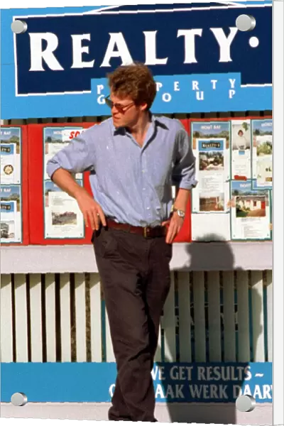 Earl Spencer looks in the Windows of the estate agents in South Africa