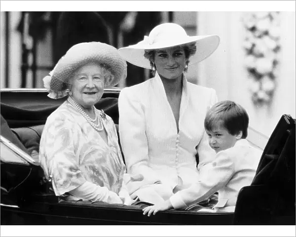 Queen Mother with Princess Diana and Prince William in an open carriage during