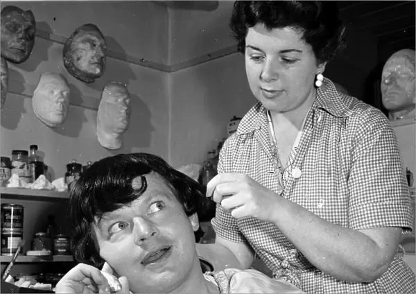 Comedian Benny Hill seen here having a wig fitted in the make up workshop