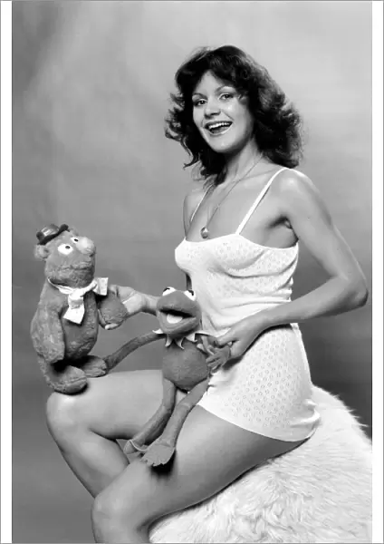 French model Froggie with two of the Muppets toys which will be on sale shortly