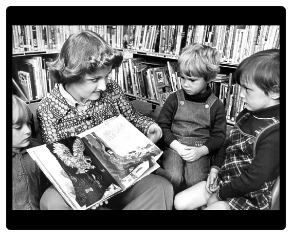 Library Assistant Christine Maley telling a story to Karen Miller