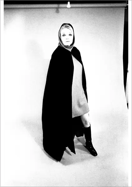 A fashion shoot from 13 April 1970 - A model wears a cloak and knee lenght boots
