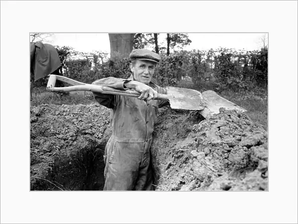 Is work wonderful?. Feature. Grave Diggers at work in the grave yard of Windlesham Church