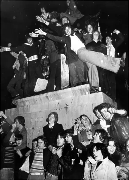 Part of the crowd of New Year revellers who besieged the statue of Lady Godiva in