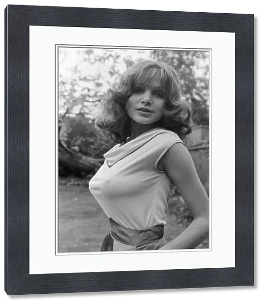 Actress Madeline Smith poses outdoors wearing sleeveless top. 12th September 1976