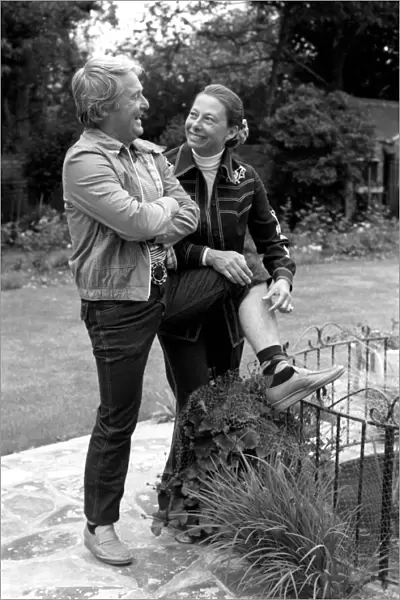 British comedian Ernie Wise showing off his fat hairy legs to his wife. June 1980