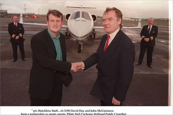 David Hay January 1998 shakes hands with Lottery millionaire John McGuinness with a jet