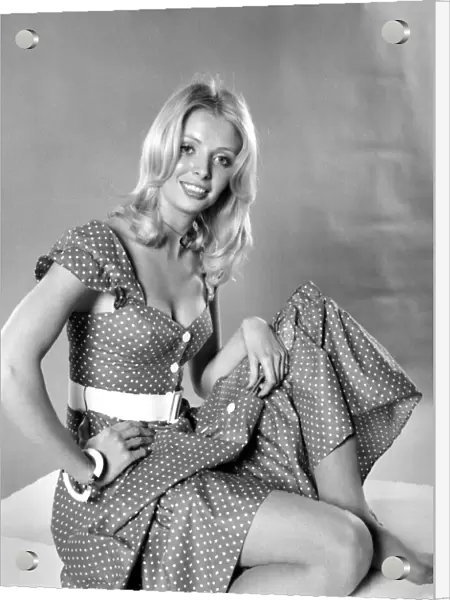 German glamour model Maureen wearing a short sleeved patterned summer dress