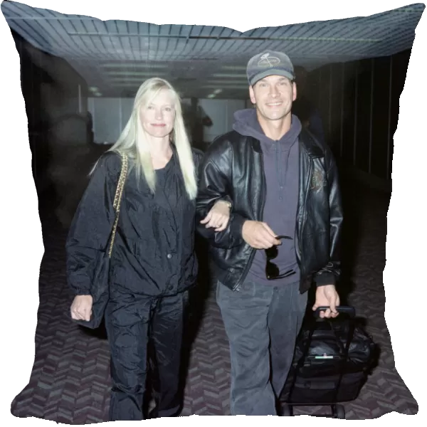 American actor Patrick Swayze with his wife Lisa on arrival at Heathrow Airport