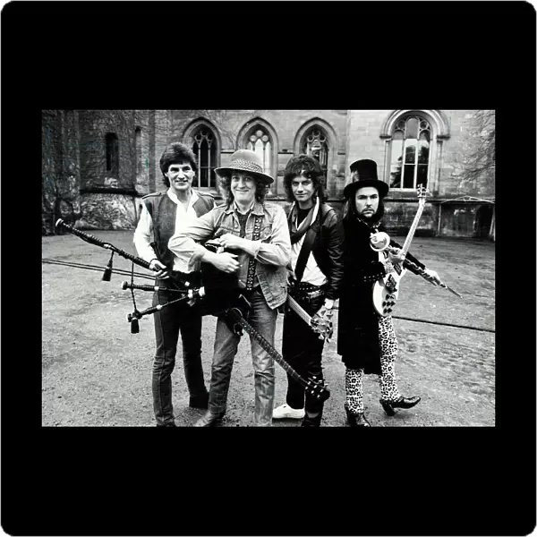 Glam Rock group Slade posing for photographs at Eastnor Castle, near Ledbury
