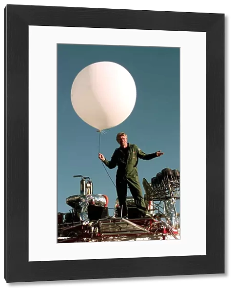Richard Branson on top of his Balloon capsule December 1997 with a small weather test