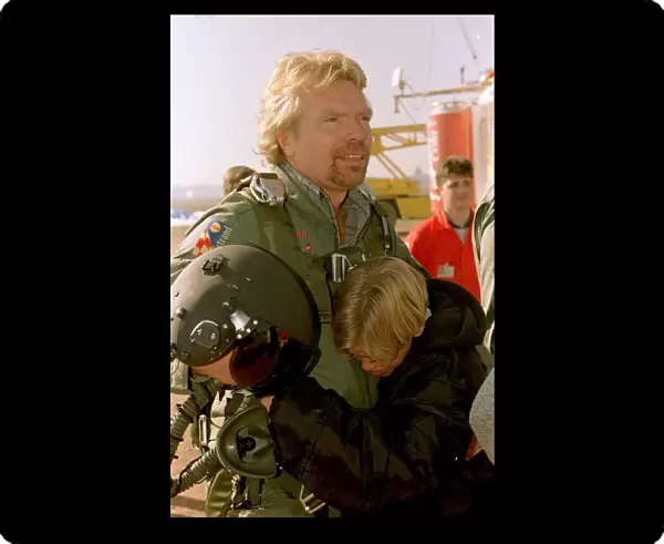 Richard Branson about to board the Virgin Global Challenger balloon is hugged by son Sam