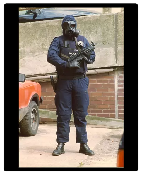 A police officer marksman in the latest high specification body armour and weapon