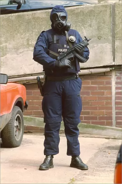 A police officer marksman in the latest high specification body armour and weapon
