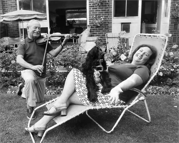Janet relaxes at home with her husband Charles, a professional violinist
