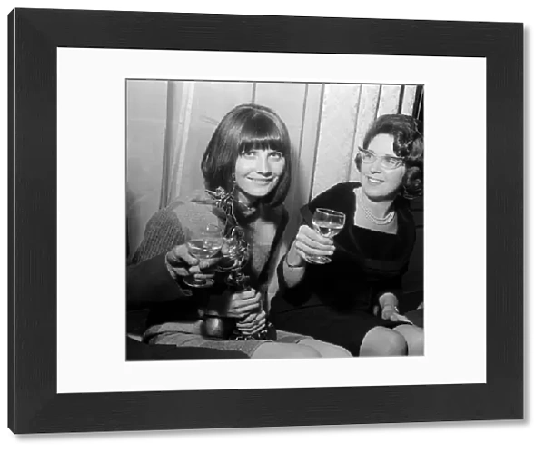 Pop singer Sandie Shaw holding the Mirror award for coming Number One in the Hit parade