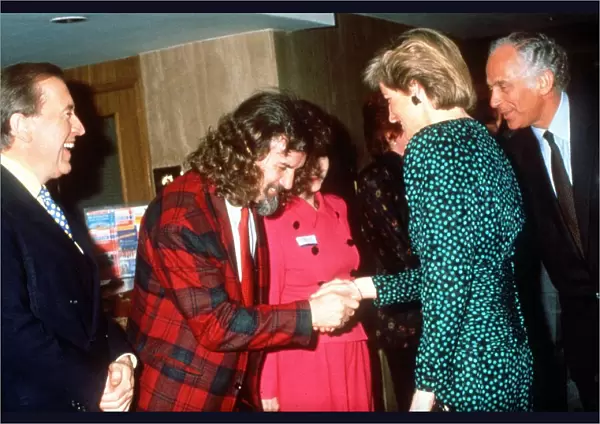 Princess Diana shakes hands with Scottish comedian Billy Connolly