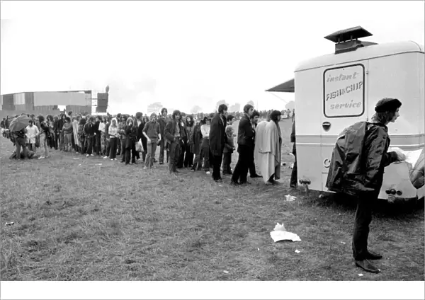 Music Fans queue for fish & chips at the Bath Festival of Blues & Progressive Music