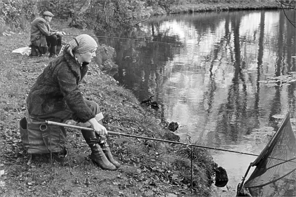 Woman angler seen here on the banks of the River Trent. 22nd November 1977