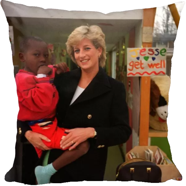 Diana, Princess of Wales, with seven year old Arnaud Wambo from Cameroon