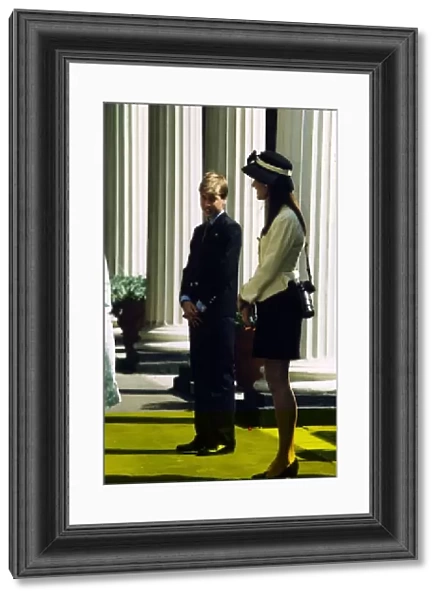 Prince William standing next to a young lady