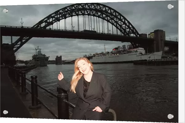 Lowri Turner tv presenter and journalist standing beside the Tyne Bridge Newcastle