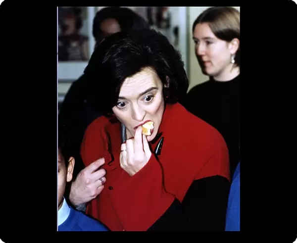 Cherie Blair wife of Labour MP Tony Blair seen eating a cake at a school in Fulham in aid
