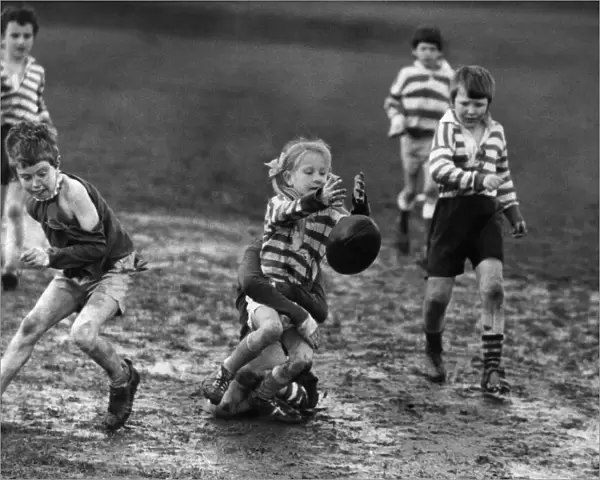 Children playing rugby in the mud 5th April 1972. When it comes to Rugby