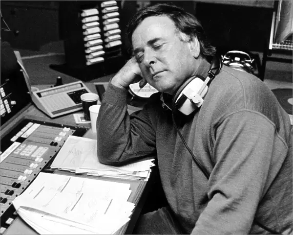 BBC radio disc jockey Terry Wogan asleep at his desk as he returns to BBC Radio Two after