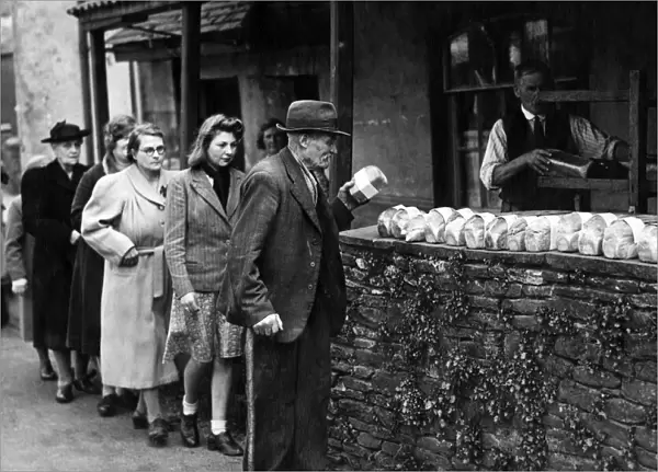 Wartime food rationing - people queuing up for their shopping - bread rationing