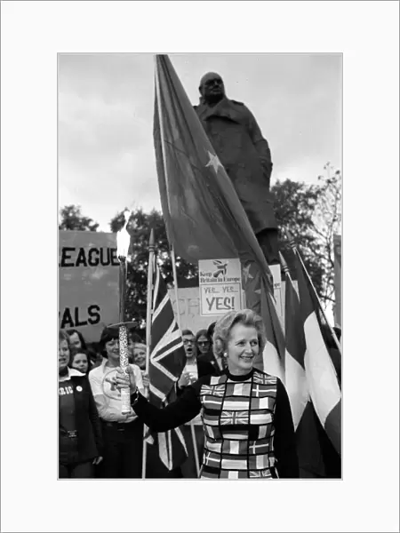 Mrs Margaret Thatcher March 1975 holding the European flag under the statue of Sir