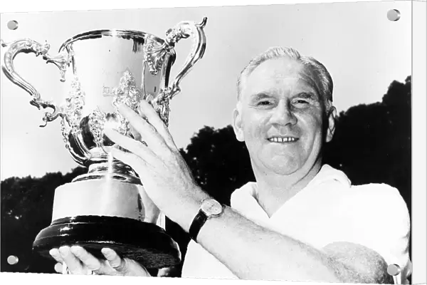 Tottenham Hotspur manager Bill Nicholson holding the league cup trophy before the start