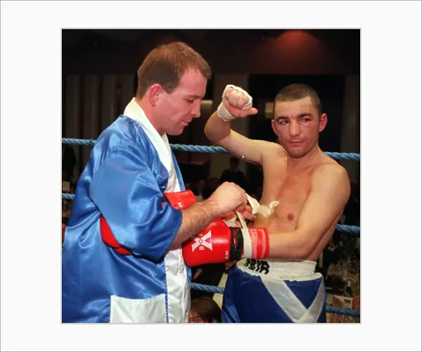 Paul Weir taking gloves off after losing fight 1998 against Alfonso Zvenyika