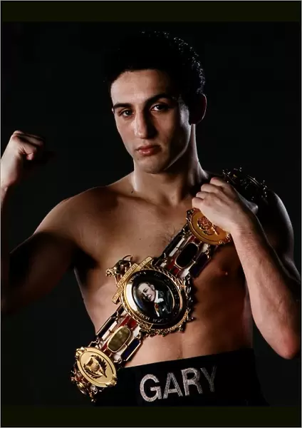 Gary Jacobs with his British Title Belt draped over his shoulder boxing Circa