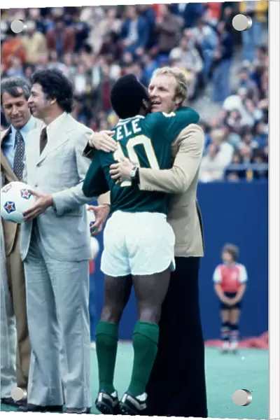 New York Cosmos star Pele hugs his long time friend Bobby Moore after playing his final