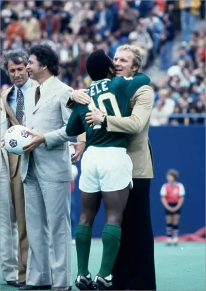 New York Cosmos star Pele hugs his long time friend Bobby Moore after playing his final