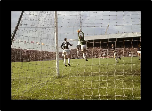 Tottenham Hotspur goalkeeper Pat Jennings makes a save during their English League
