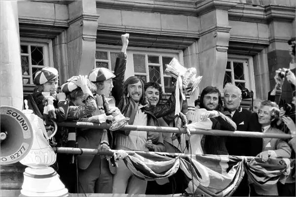 Triumphant West Ham captain Billy Bonds with players as they parade the FA cup trophy to