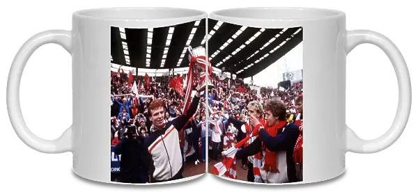 Aberdeens Alex McLeish holds the European Cup Winners Cup trophy for fans at