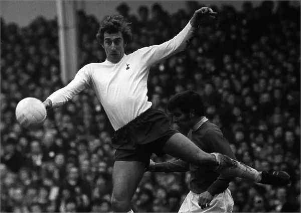 Tottenham Hotspurs Martin Chivers outjumps Evertons Henry Newton during their league