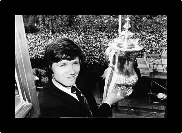 Steve Perryman with the FA cup and thousands of Tottenhan Hotspur fans behind him
