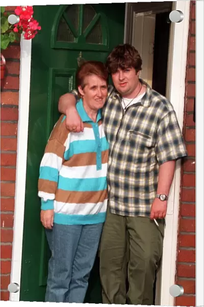 Peggy Gallagher Oasis mum is hugged by son Paul as they look sad after the reported break