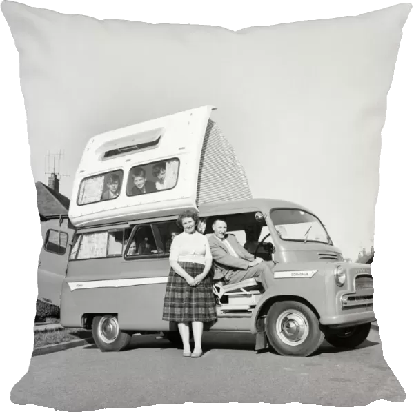 Holidays: Camping. The Astley family seen here getting to grips with their new Dormobile