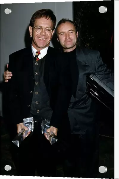 Phil Collins Singer and Elton John at award dinner at Park Lane Hotel